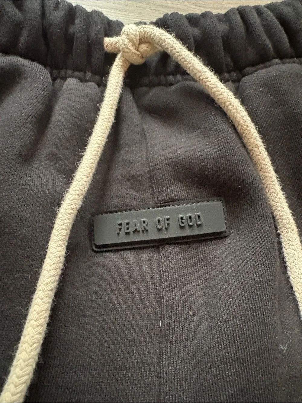 Fear of God ESSENTIALS Black Tee with Cream Hang Tag
